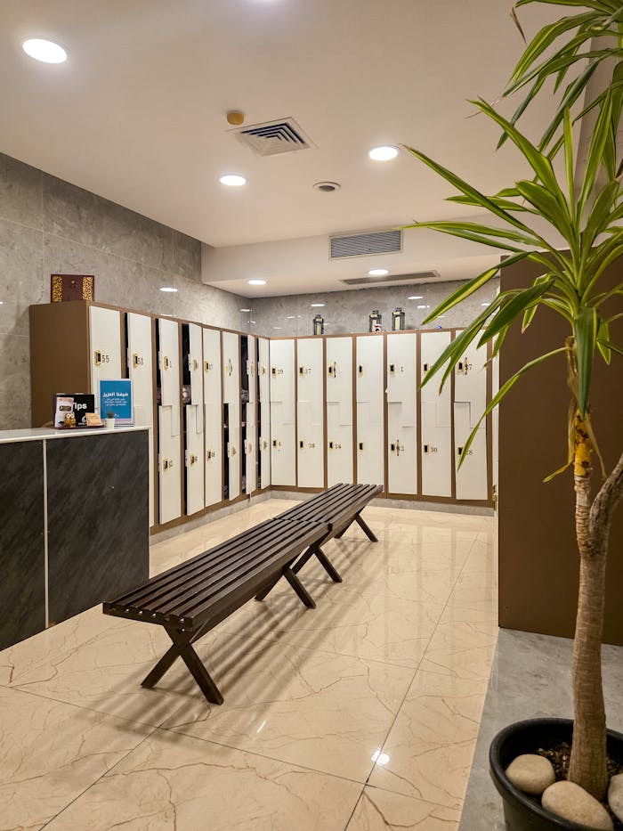 Home modern-gym-locker-room-with-bench-and-lockers-34201254